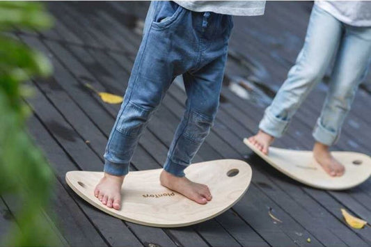 Montessori Balance Board in use by two children
