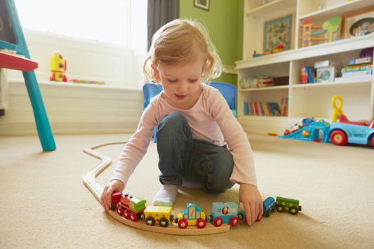 Where to Buy Used Toys Online child plays with train set