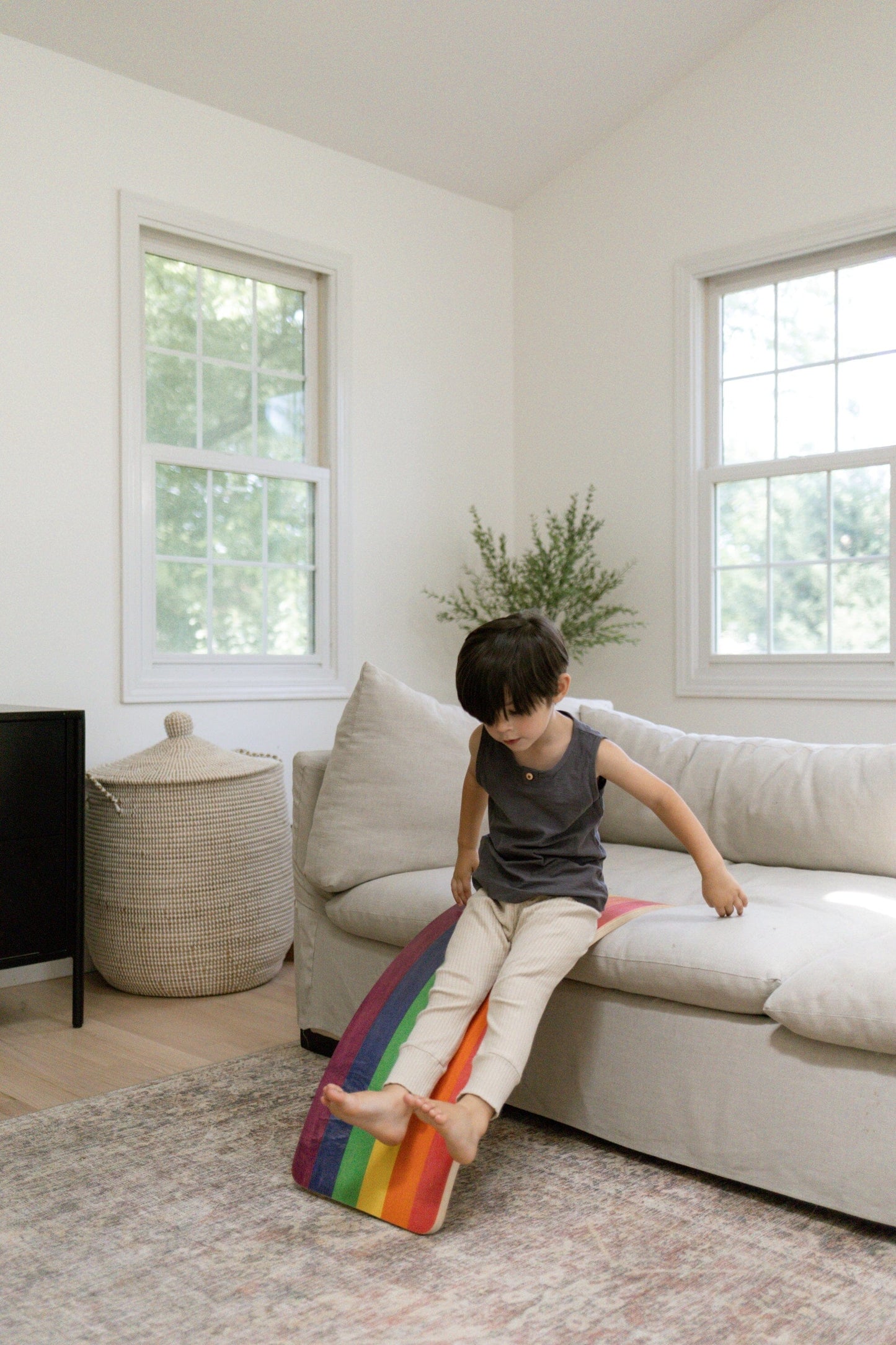 Montessori balance board in use as a slide