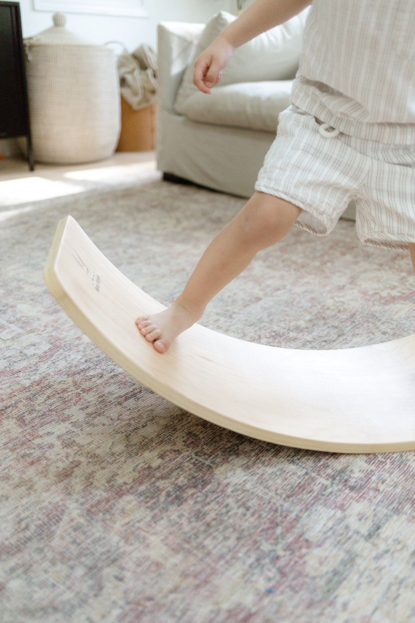 Montessori balance board close up child's foot