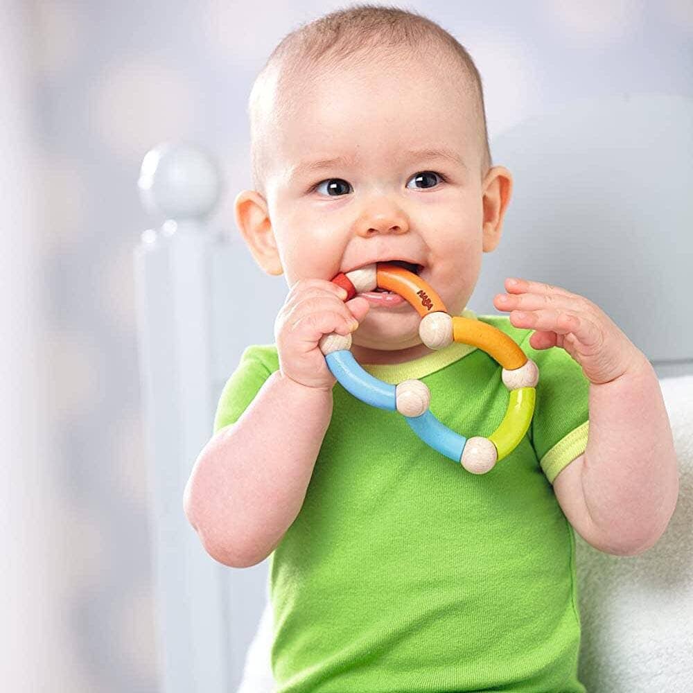 Baby chews HABA Color Snake Wooden Rattle & Fidget Toy Wooden Baby