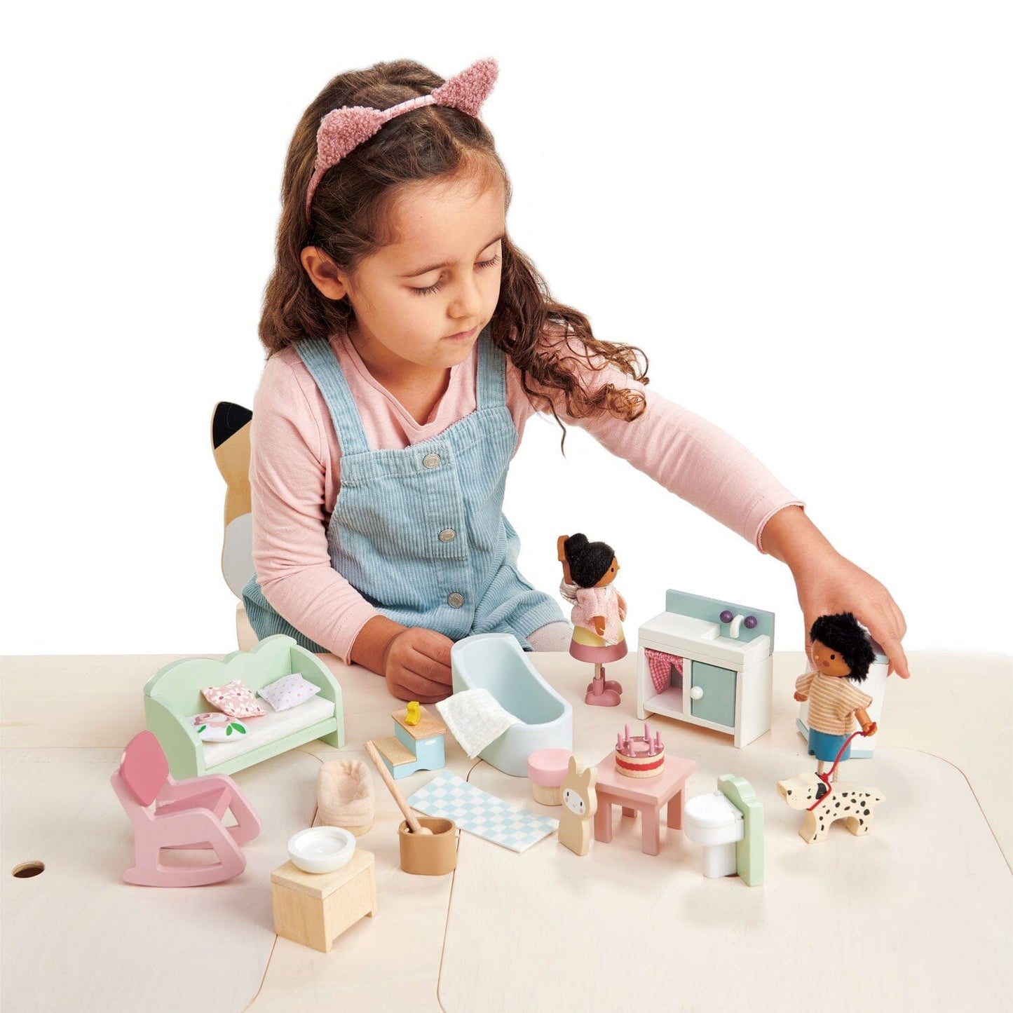 Child plays with Countryside Dolls House Wooden Furniture Set