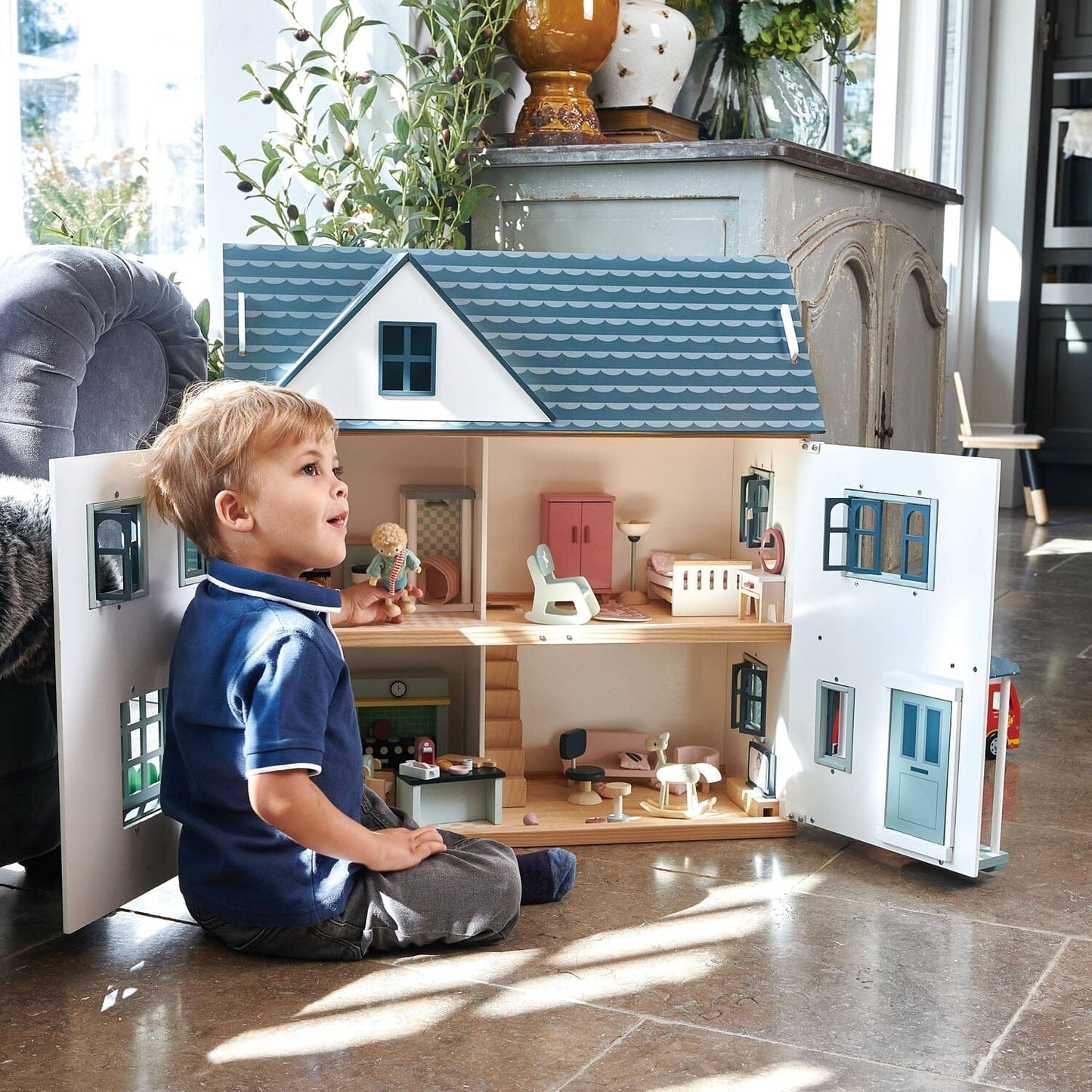 Child plays with open Tender Leaf Dollhouse Dovetail House