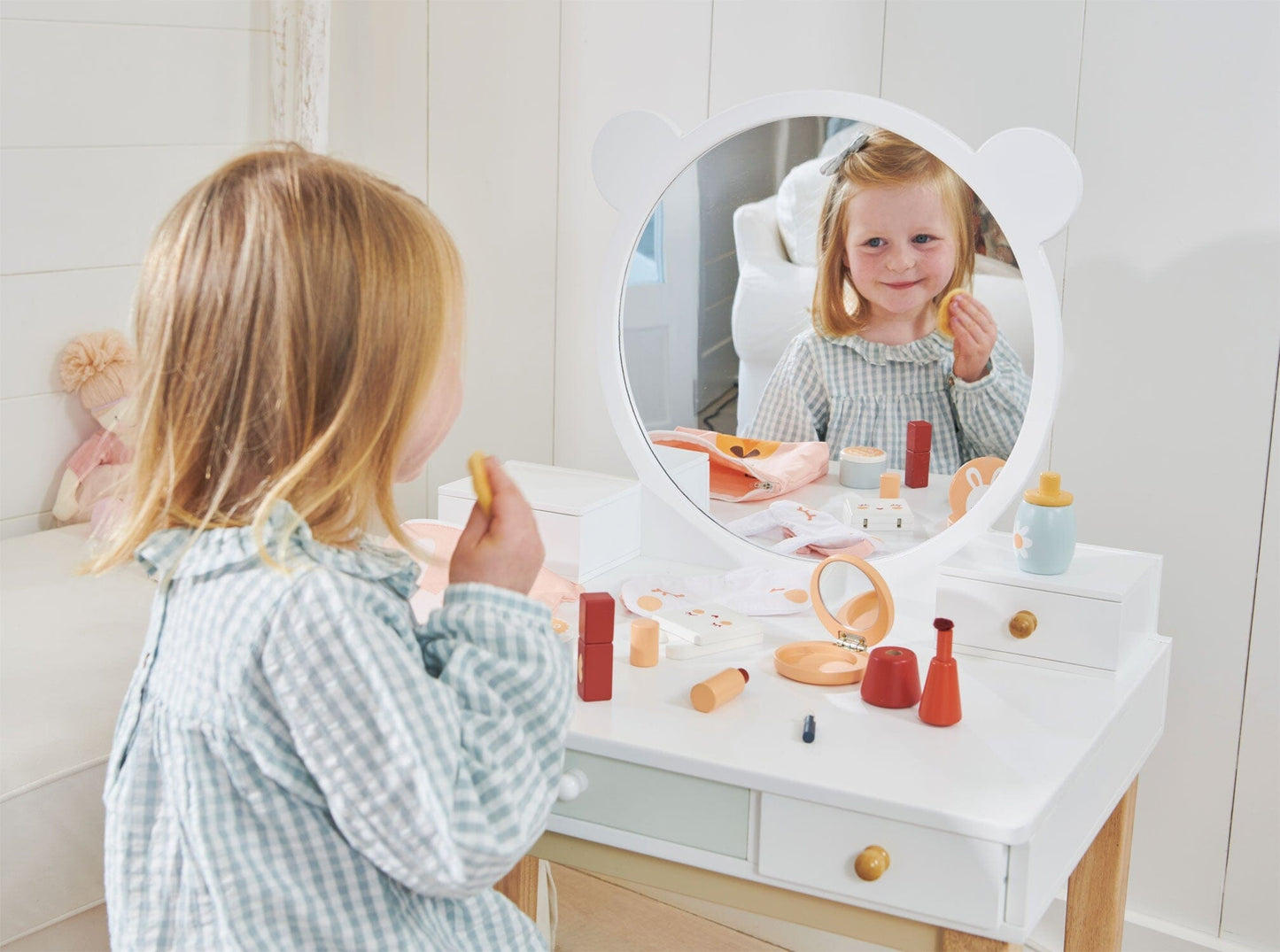 Mirror reflection of child seated at Childs Dressing Table Set from Tender Leaf