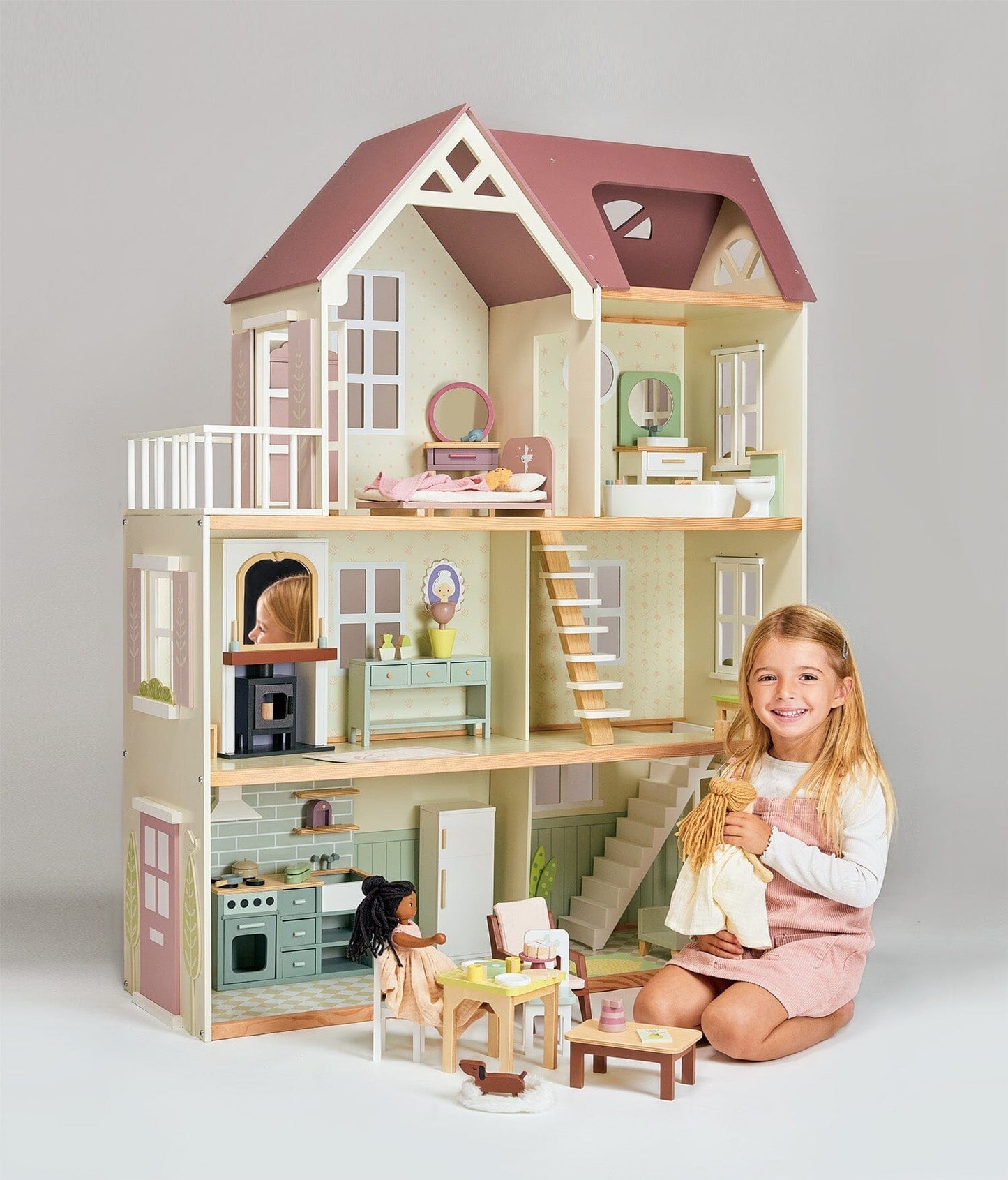 Child plays with Wood dollhouse with furniture Tender Leaf Mulberry Mansion