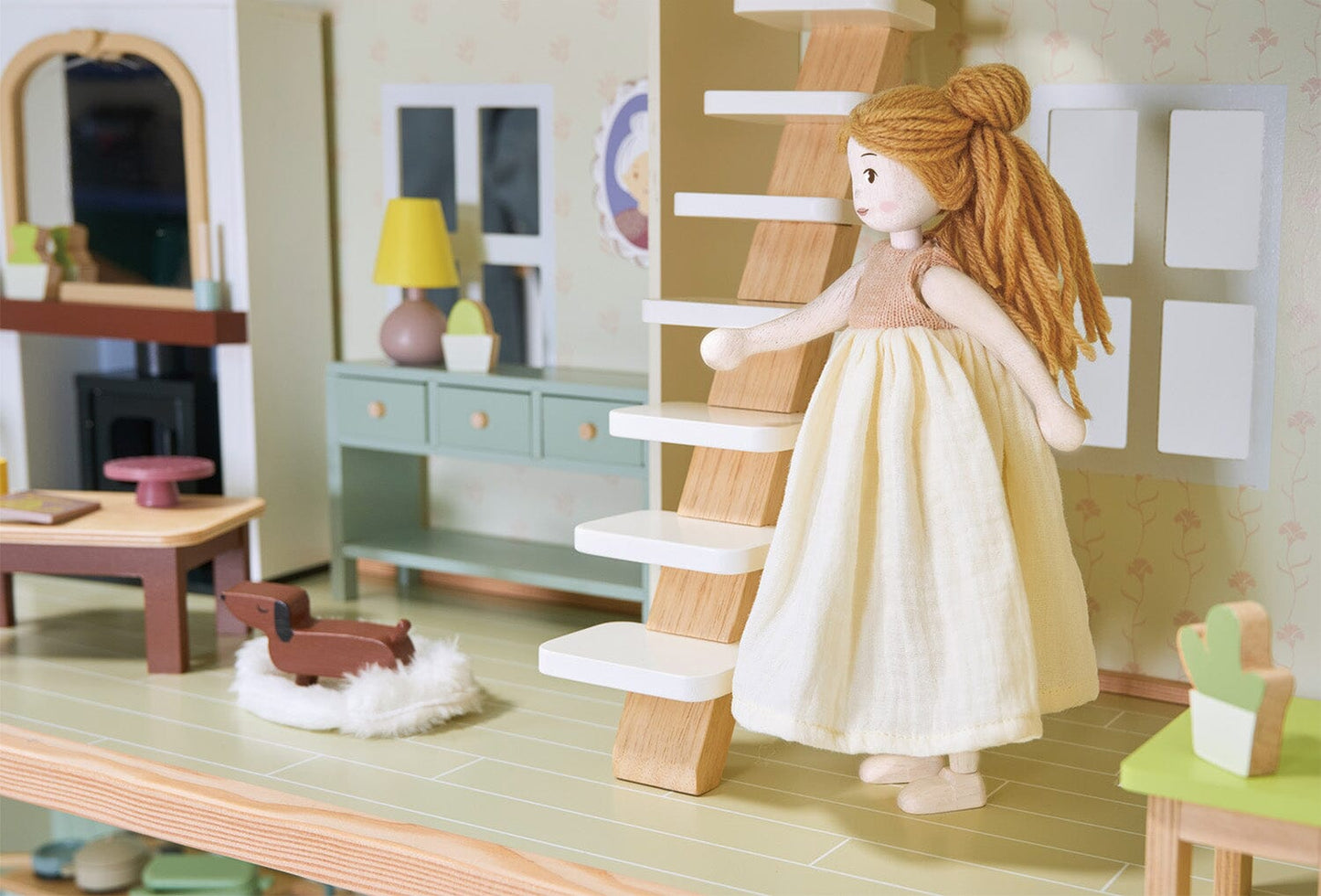 Doll positioned in Wood dollhouse with furniture Tender Leaf Mulberry Mansion