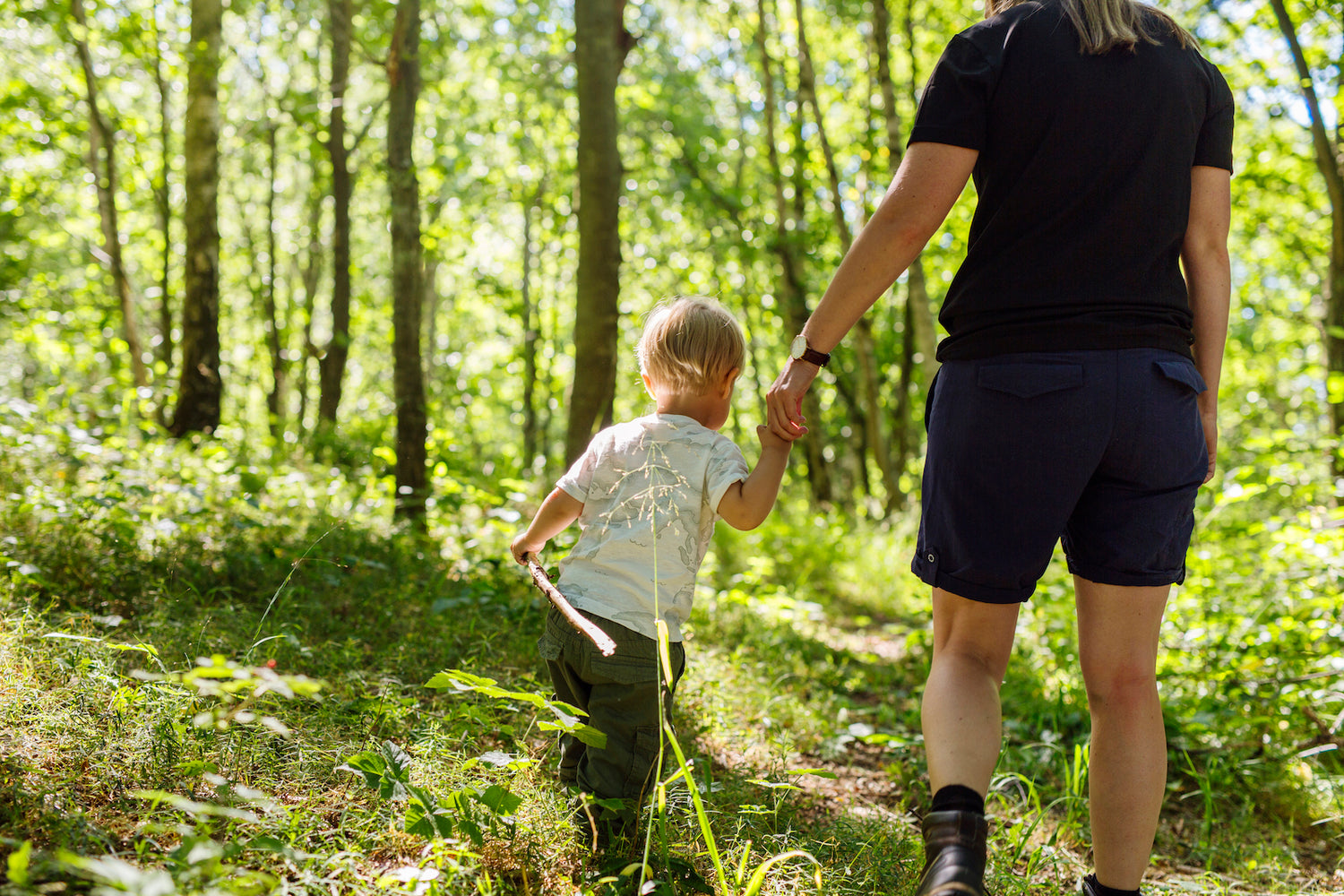 Mom and child in woods - toycycle online thrifting store about page