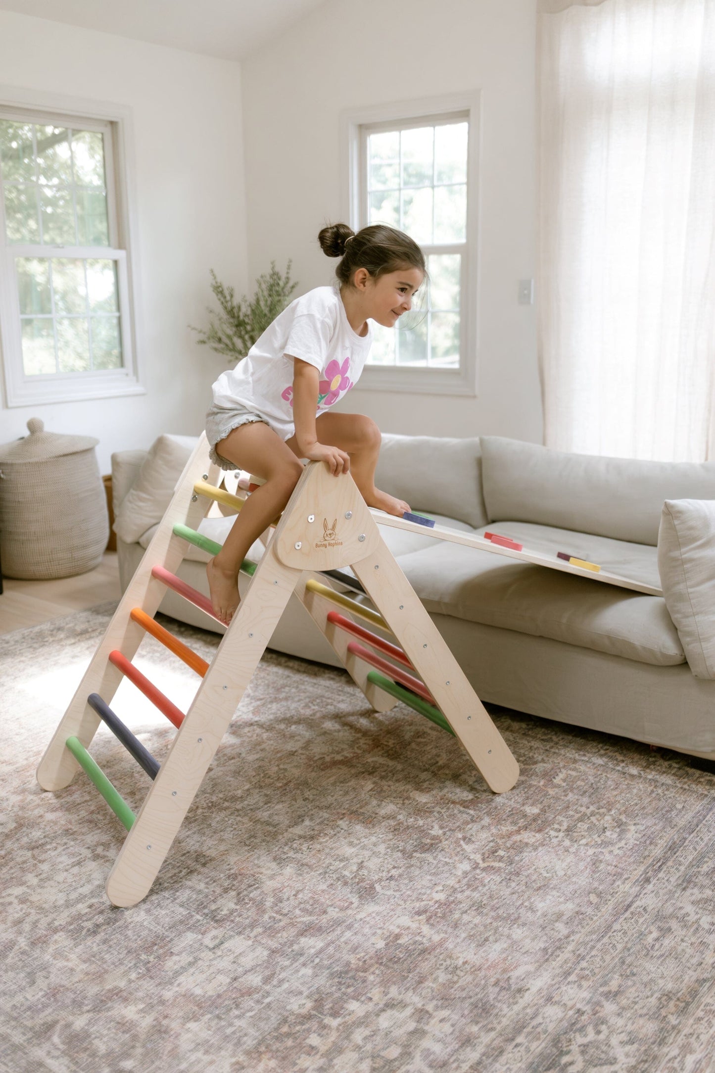 Child plays on Bunny Hopkins Pikler Climbing Triangle