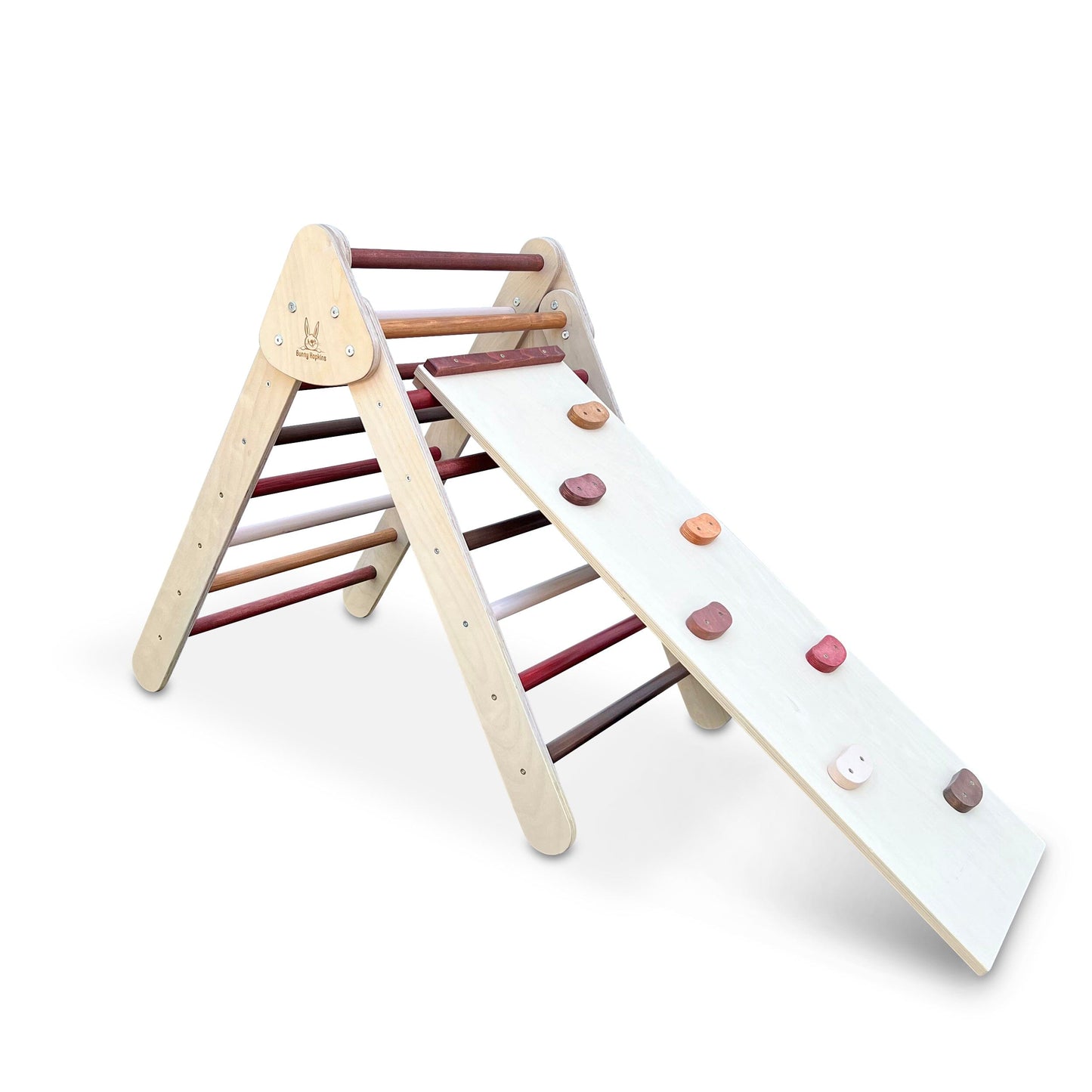 Child plays on Bunny Hopkins Pikler Climbing Triangle with climbing wall