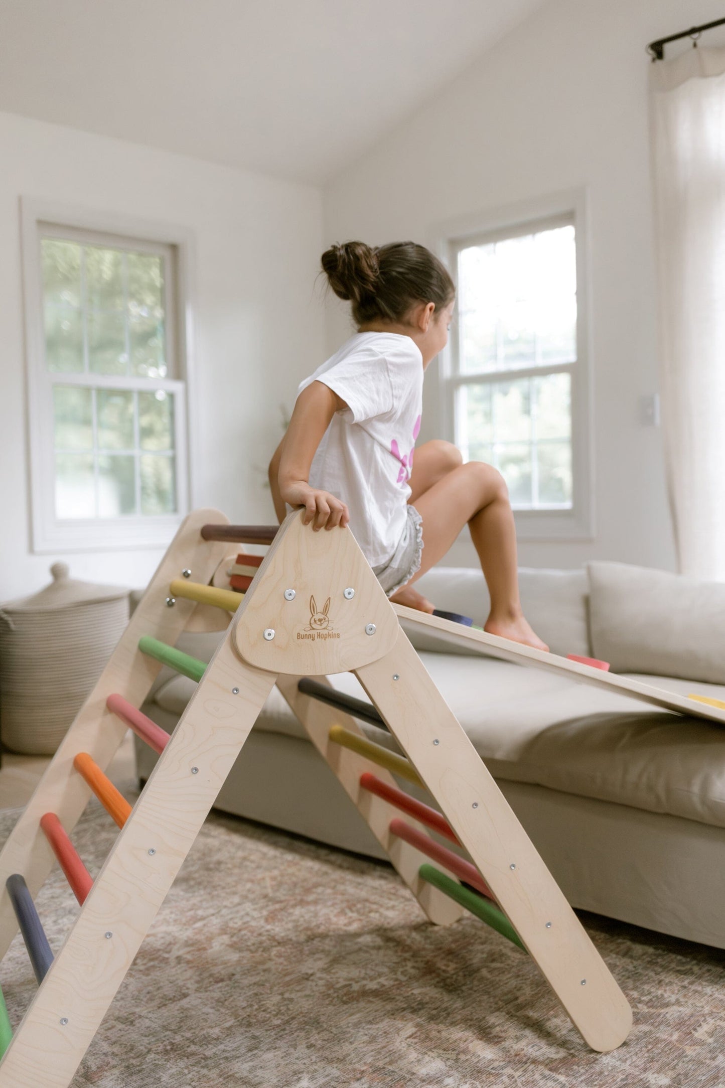 Child plays on Bunny Hopkins Pikler Climbing Triangle