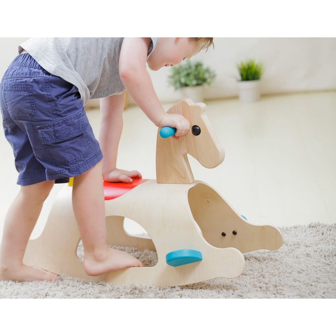 Child with PlanToys Palomino Wood Toy Horse Ride-on