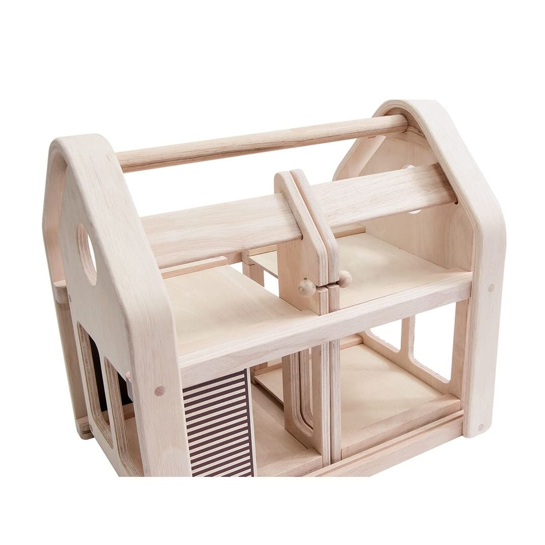 PlanToys Slide N Go wooden folding Dollhouse and Furniture set in closed position - natural unfinished wood.