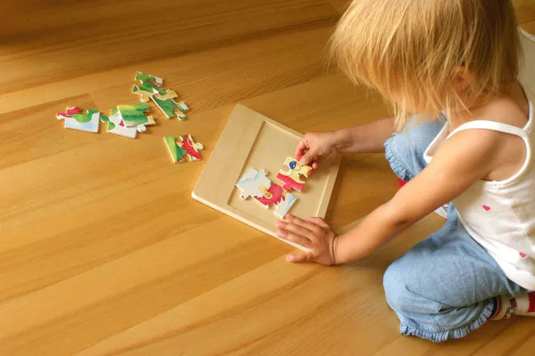 Toddler playing with Farm Puzzle 