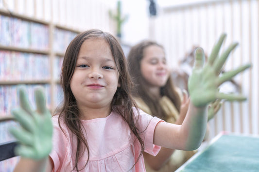 What are sensory toys? Girl plays with slime in Montessori classroom