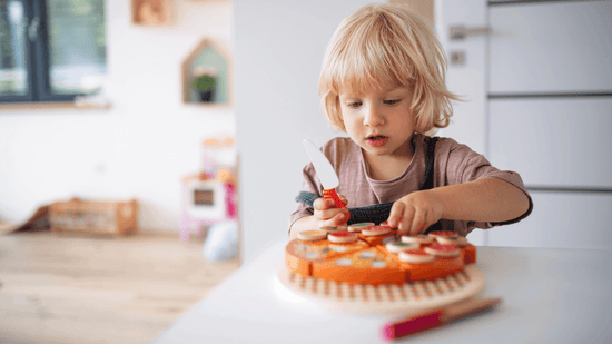 Boy playing with pretend play food toys - quality used toys from Toycycle