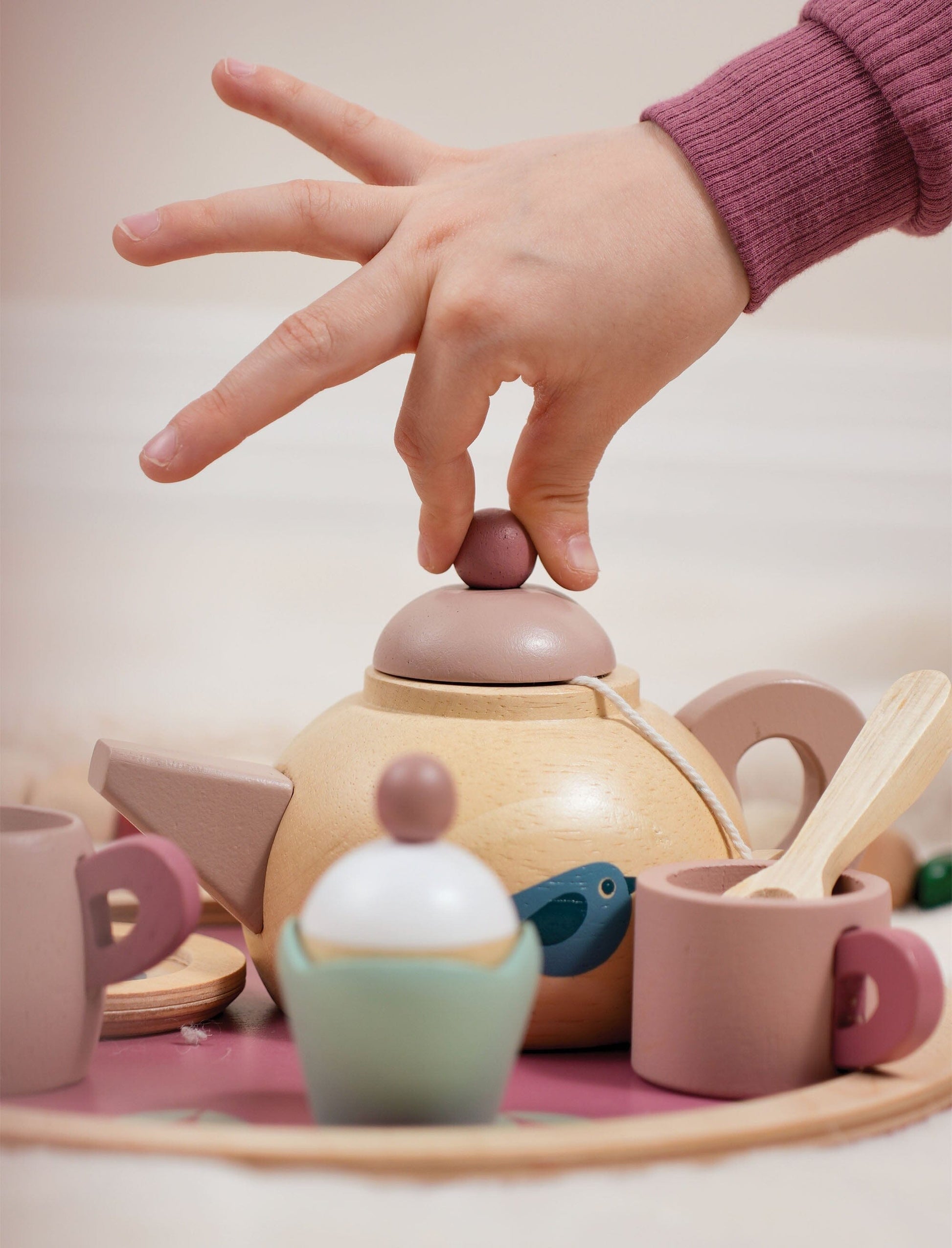 Child plays with Birdie childrens tea party set from Tender Leaf
