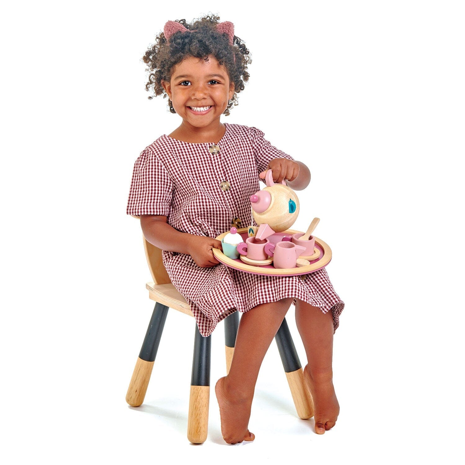 Smiling child with Birdie childrens tea party set from Tender Leaf