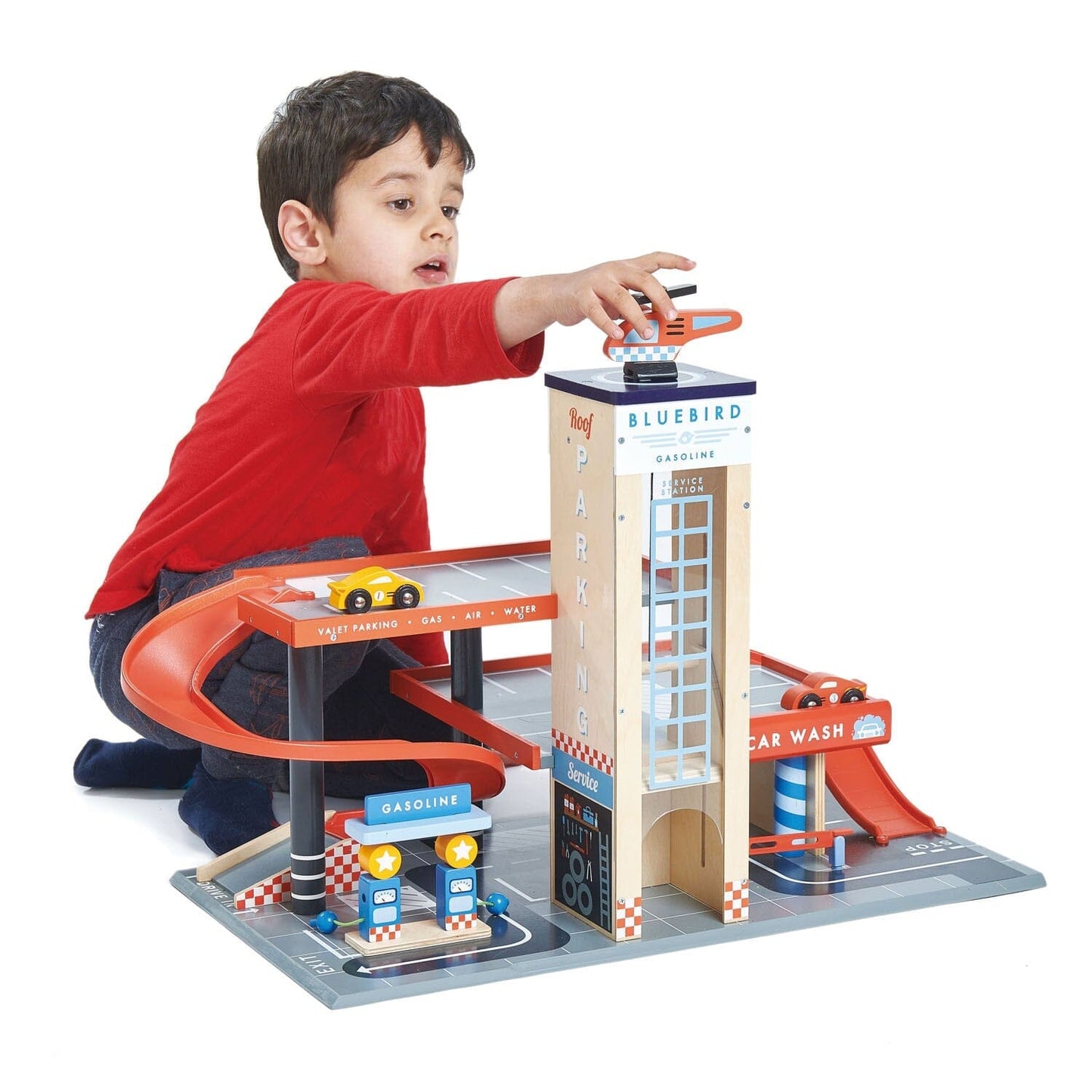 Child Plays with Blue Bird Toy Garage and Gas Station