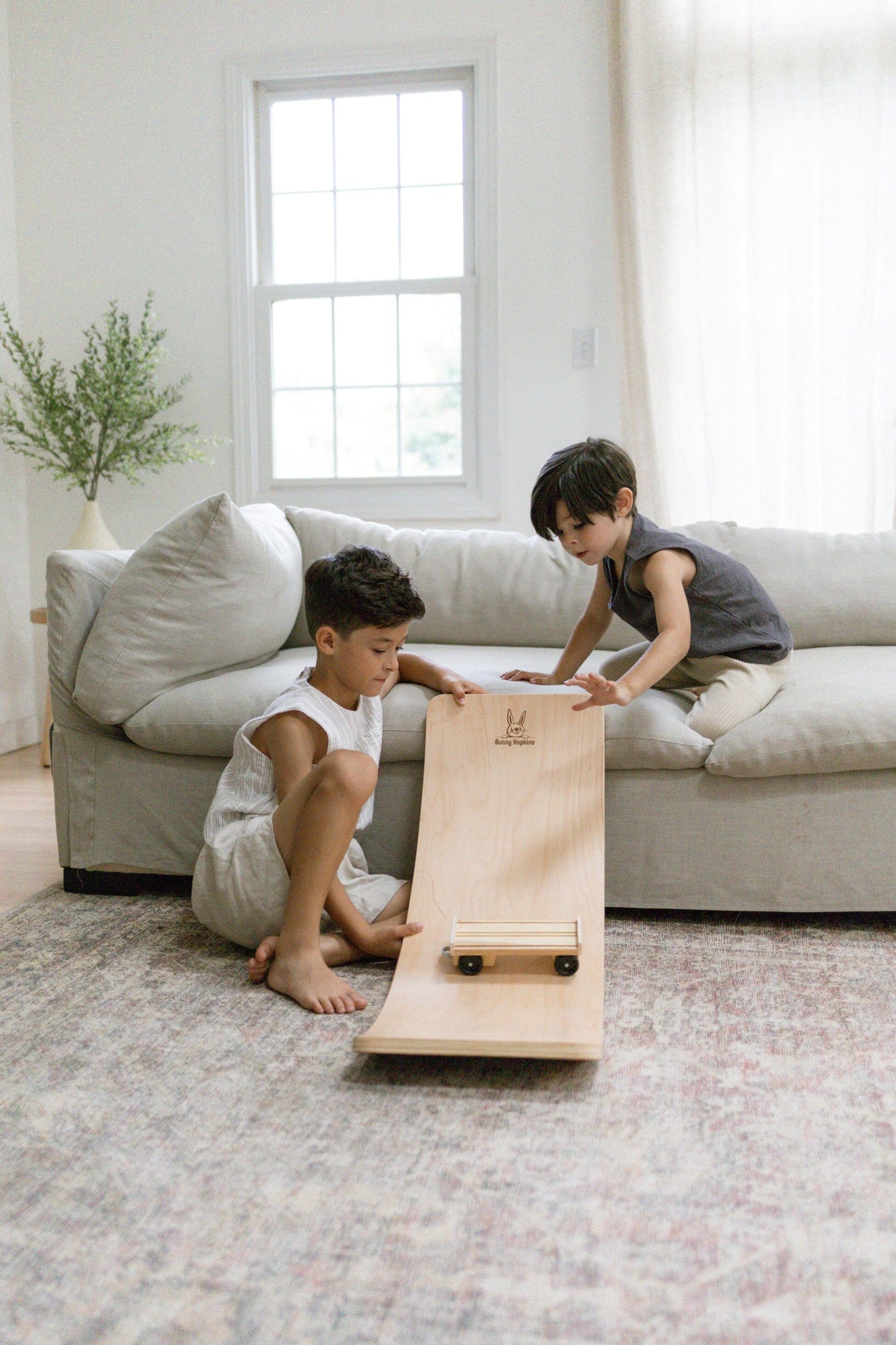 Montessori balance board as a slide for toys