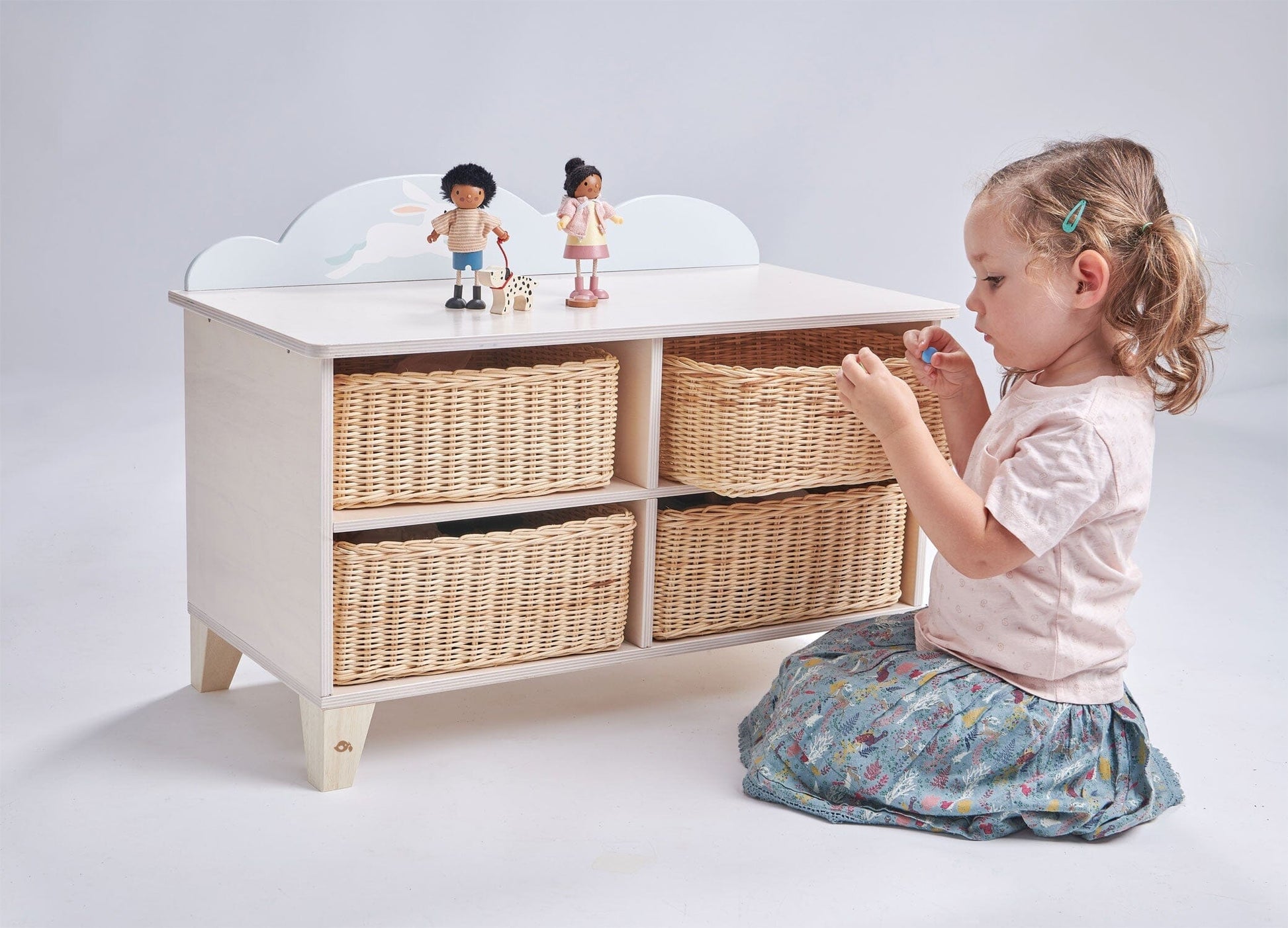 child plays in front of Tender Leaf Bunny Storage Unit for play room or bedroom