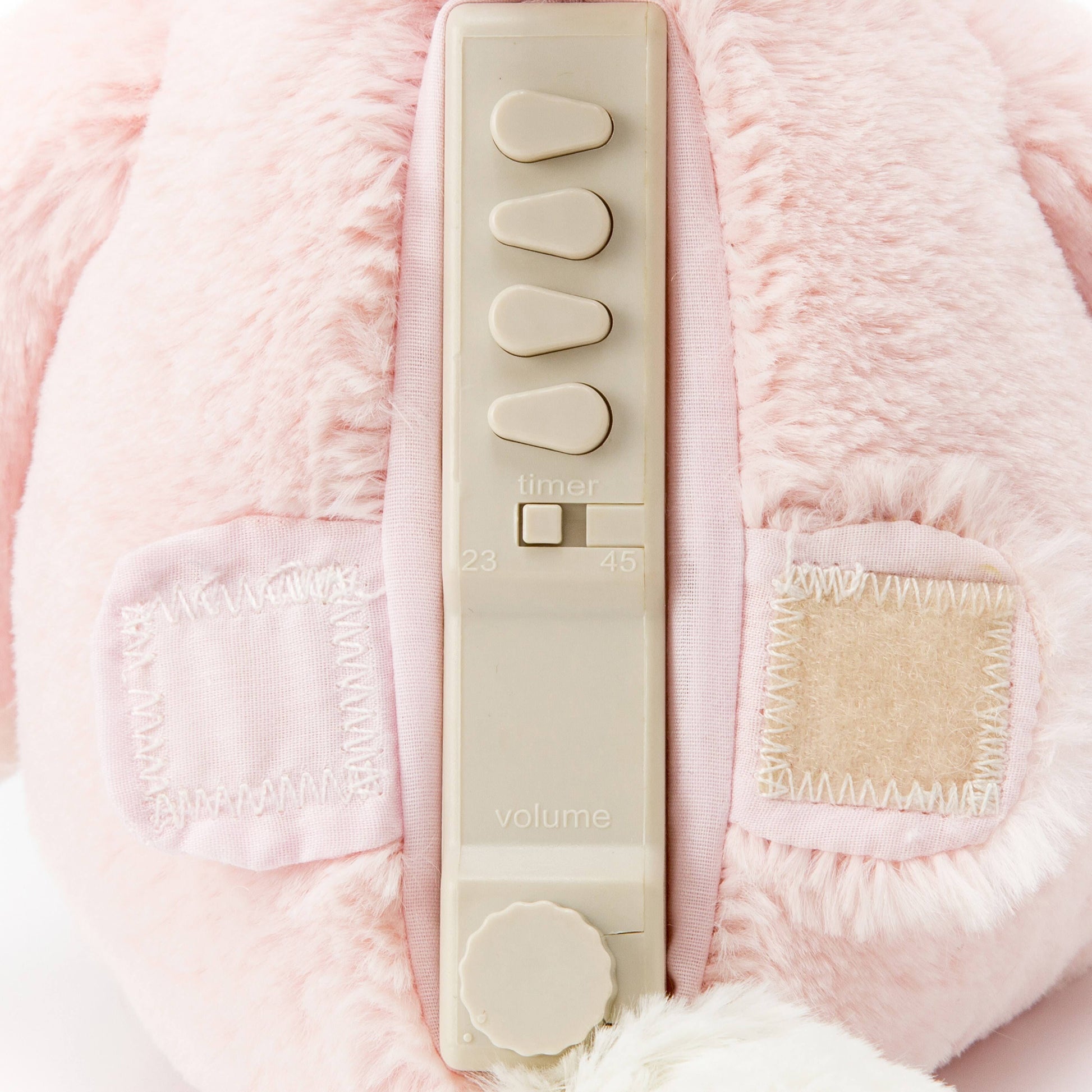 Close-up of the backside control panel for Ella the Unicorn stitched patch pockets and soft texture.