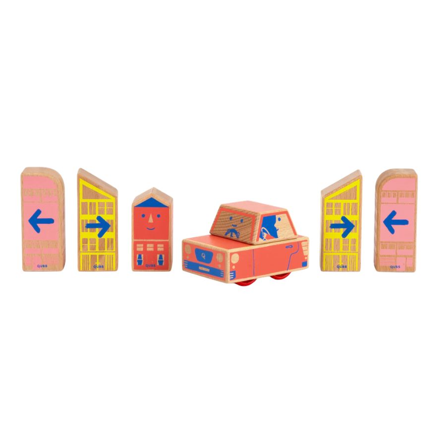 Wooden Cody Blocks Car and traffic sign blocks for children, featuring pink and yellow directional signs with blue arrows and a red-orange car with a driver figure, shown on a white background.