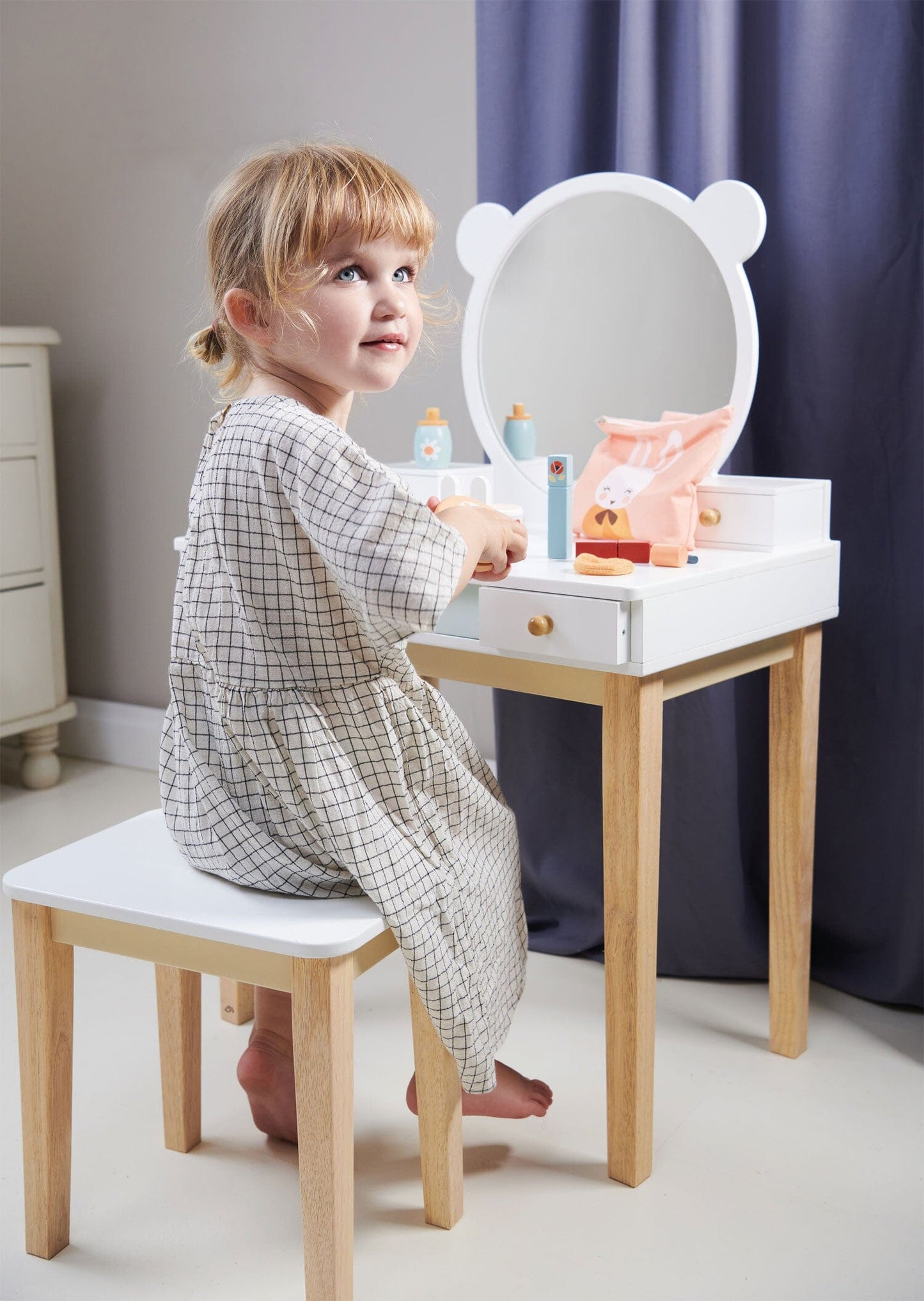 Child seated at Childs Dressing Table Set from Tender Leaf