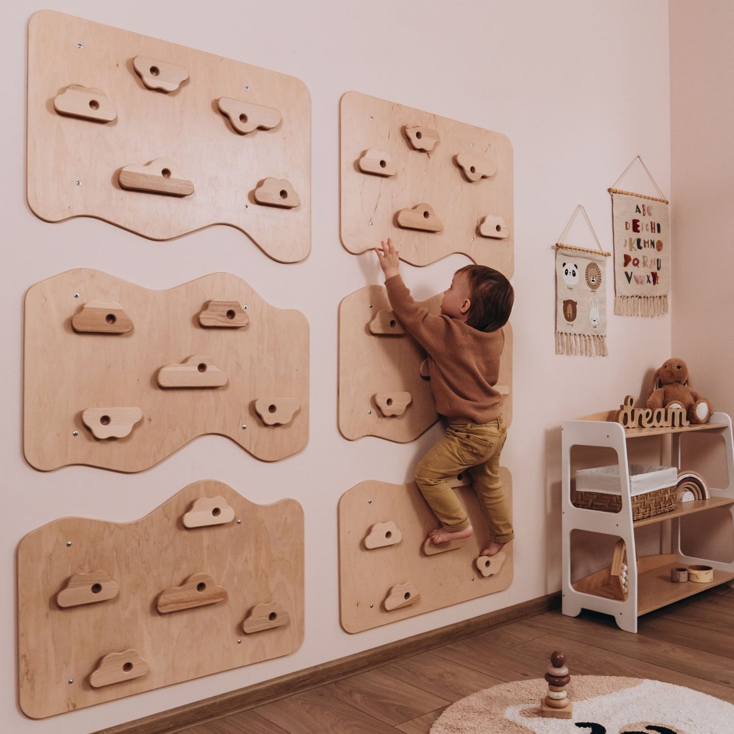 Child Using Woodandhearts Rock Climbing Wall at Home