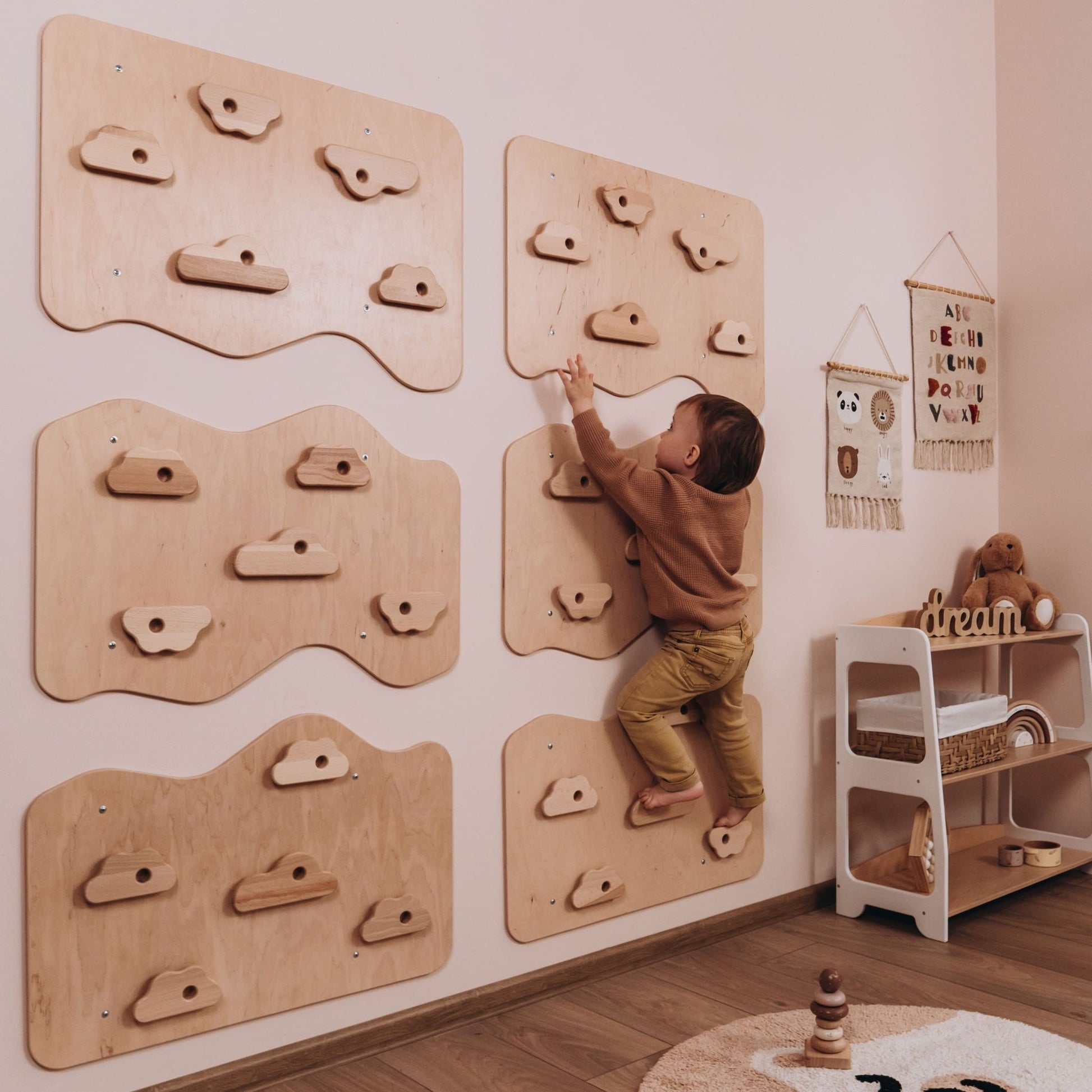 Child Using Woodandhearts Rock Climbing Wall at Home
