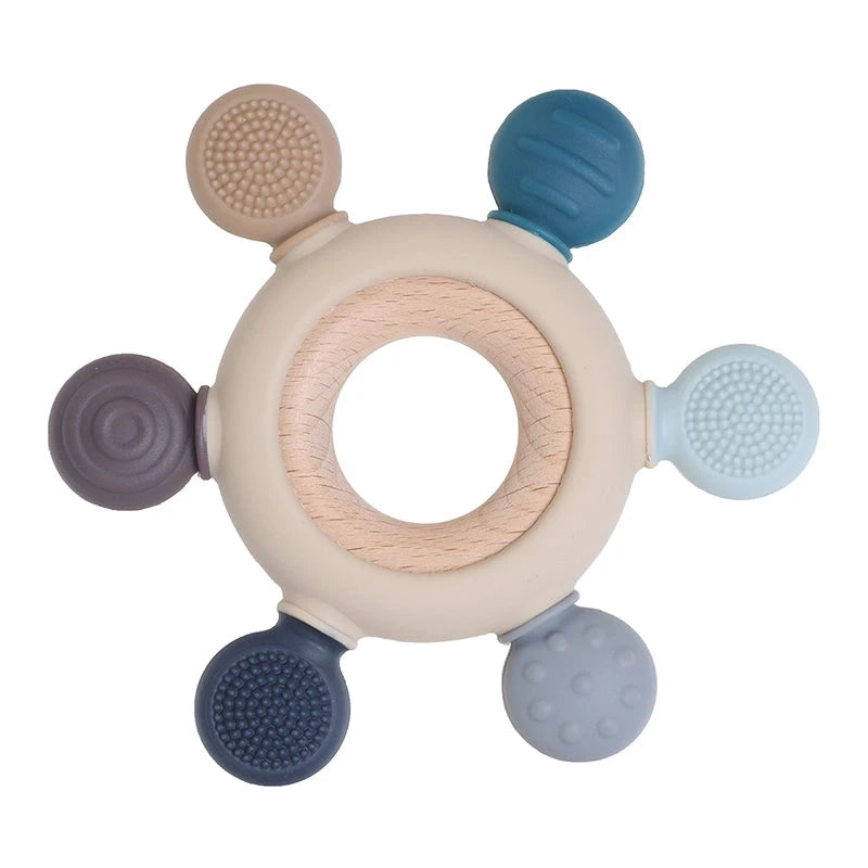 Infant teething toy with round knobs in bluecolors.