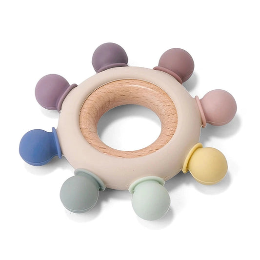 Infant teething toy with round knobs in neutral colors.