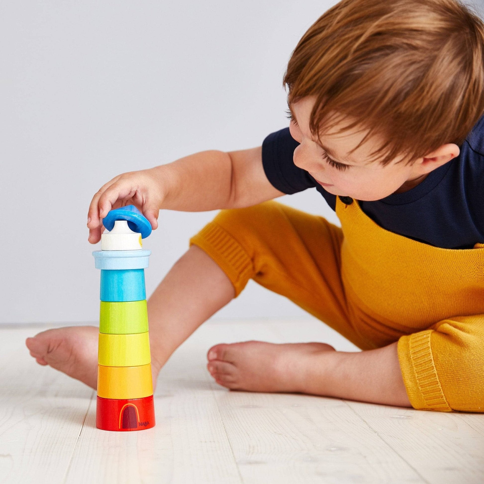 HABA USA - Lighthouse Wooden Rainbow Stacker