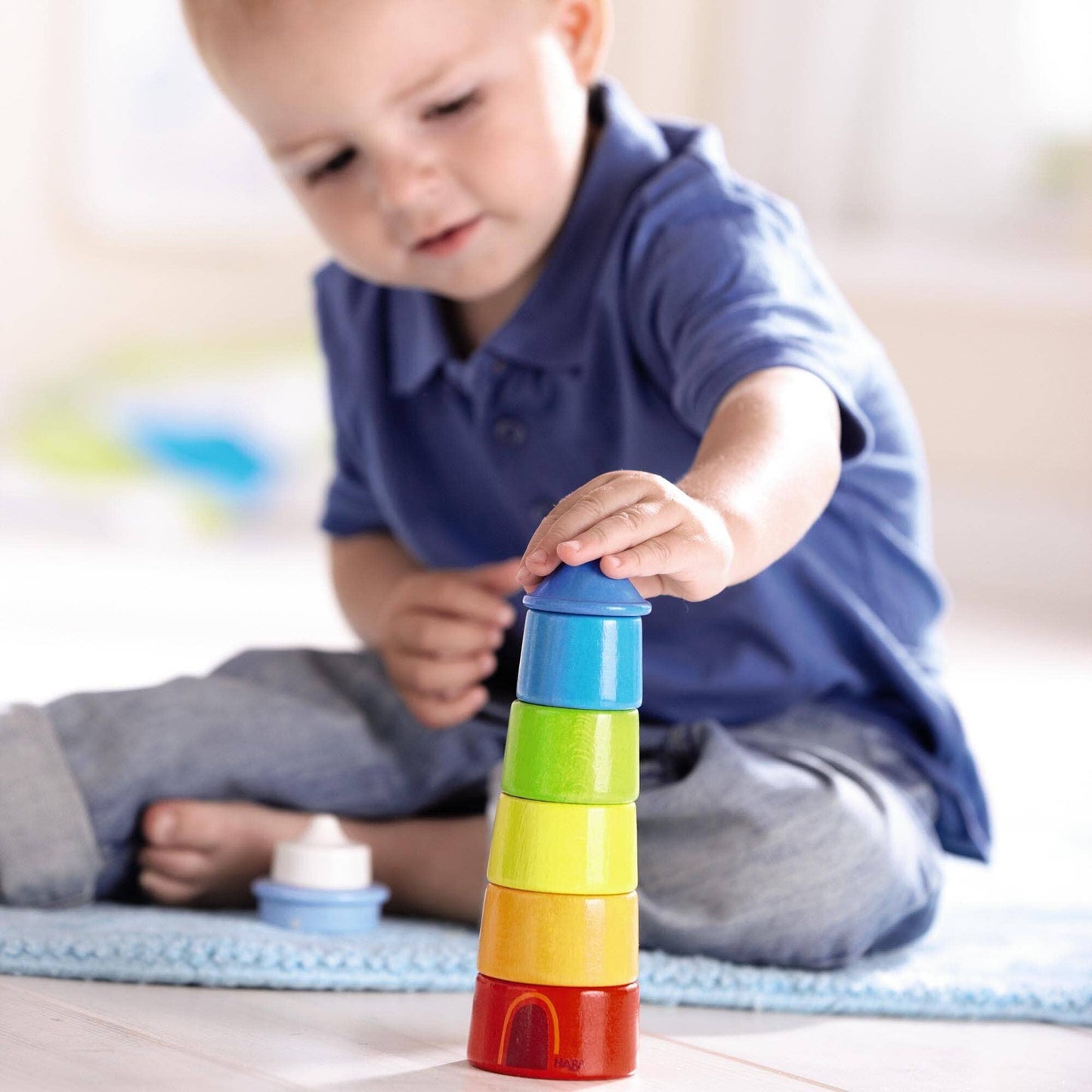 HABA USA - Lighthouse Wooden Rainbow Stacker