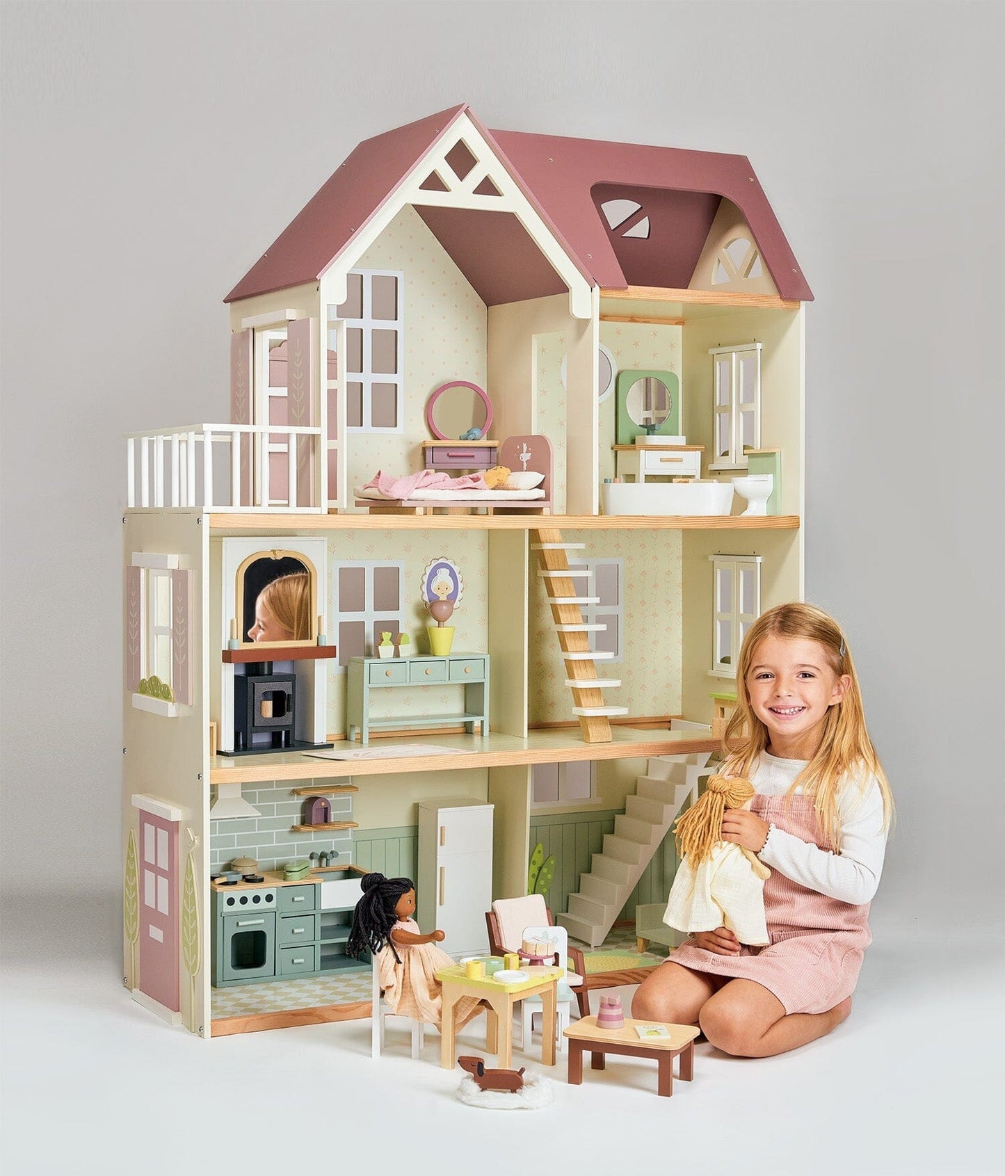 Child plays with Wood dollhouse with furniture Tender Leaf Mulberry Mansion 