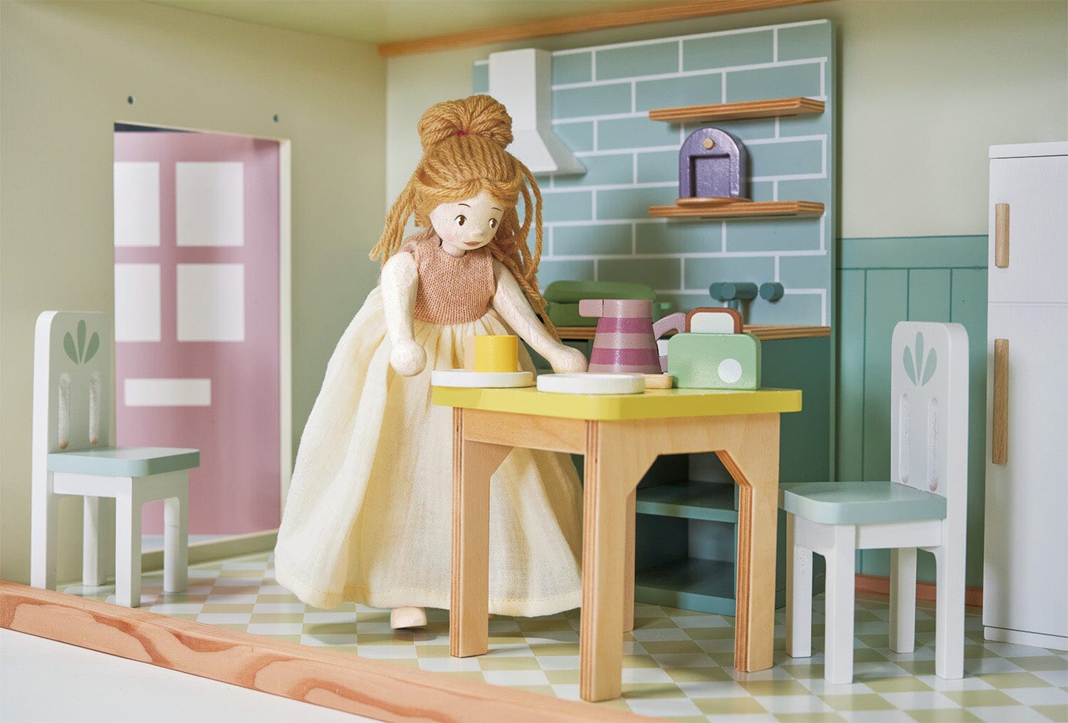 Doll in kitchen in Wood dollhouse with furniture Tender Leaf Mulberry Mansion 