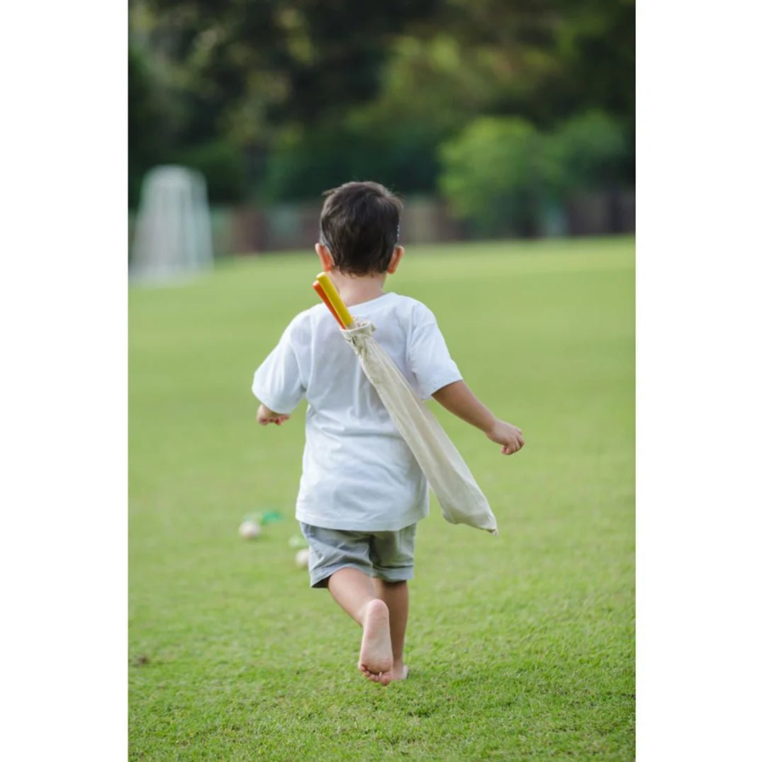  PlanToys Mini Golf Set - child chases ball