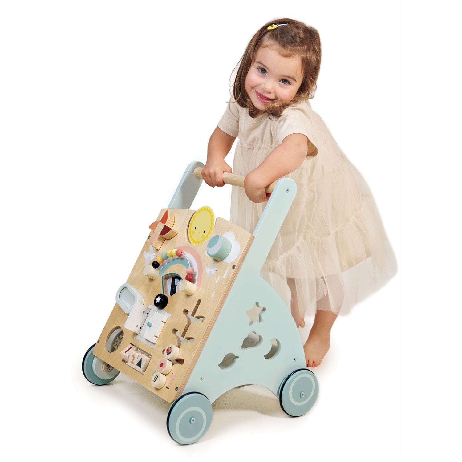 Child pushes infant walker toy from Tender Leaf Toys
