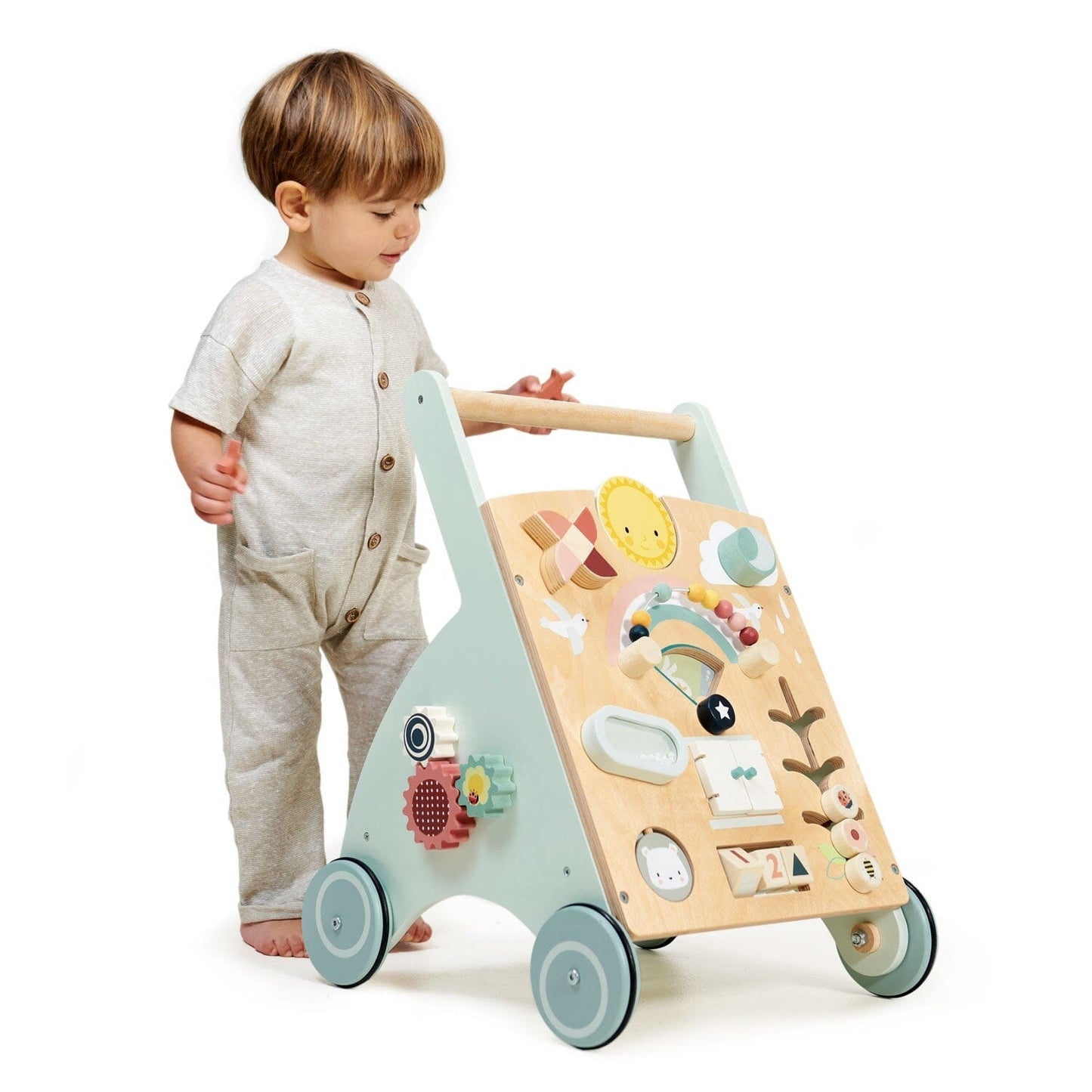 Child pushes infant walker toy from Tender Leaf Toys