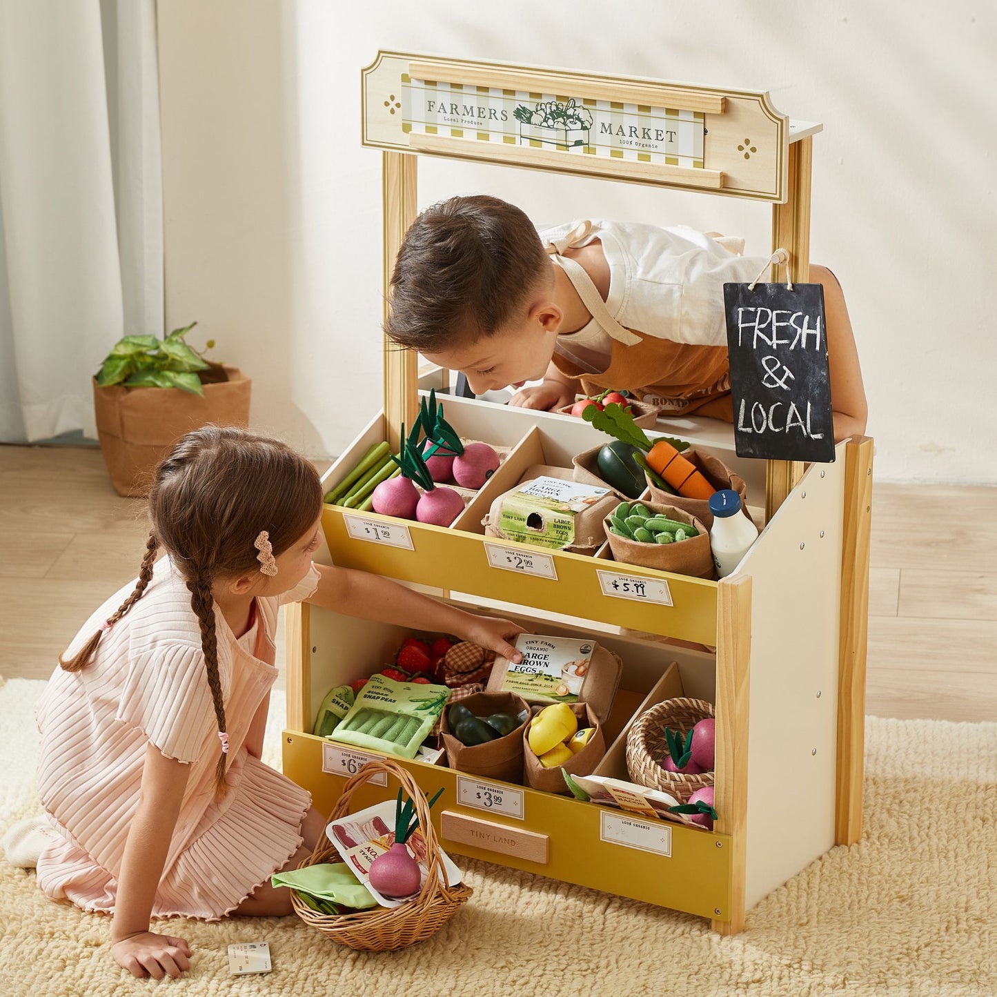 Kids play with Tiny Land® Wooden Play Food Set