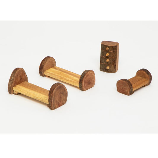 Three small Tree Blocks beds and a dresser made from natural wood, shown on a plain light background.