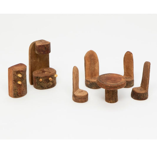 A set of Tree Blocks hand-carved wooden miniature furniture pieces, including a round kitchen table, four chairs, and two stools, displayed on a clean white background.