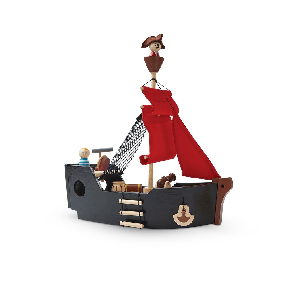 PlanToys wooden Pirate Ship black boat with red sail and wooden pirate figures, the pirate captain in the crow's nest.