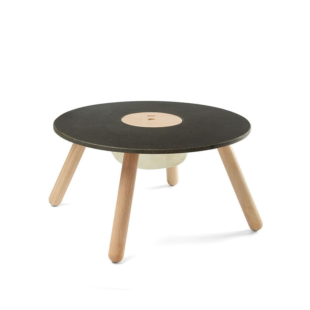 PlanToys wooden round table with natural wood unfinished legs, black top and storage unit.